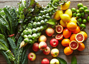 a group of fruits and vegetables on a wood surface Healthy Weight Loss Diets Leicestershire
